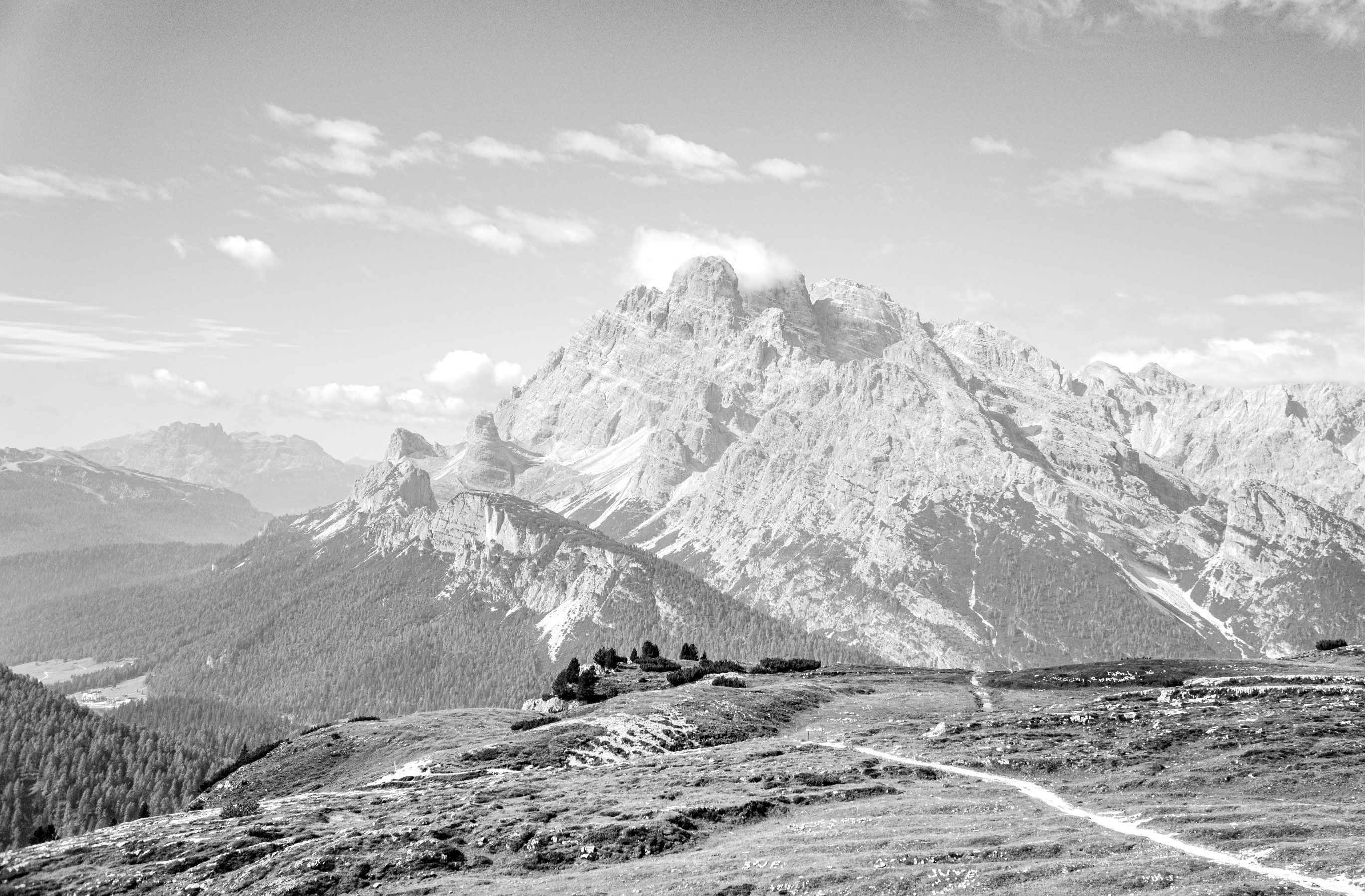 Panoramic black and white mountain landscape symbolising permanence, endurance, and long-term investing — Lasaltum Capital